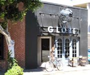 Globe restaurant builtform construction dining outside steel facade